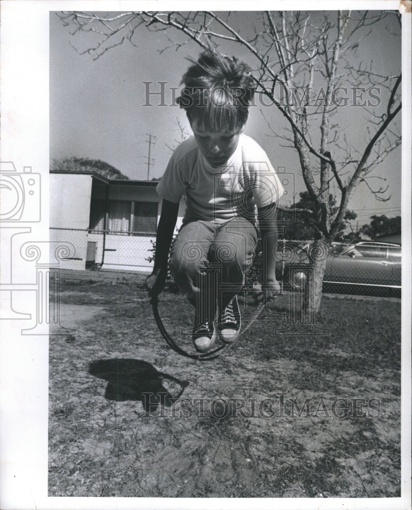 1974 Lewis Owen works on his "studies" at the Hop, Skip, & Jump - Historic Images