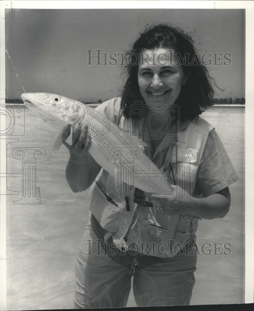 1993 Susie Fitzgerald holds bonefish caught at Christmas Island - Historic Images