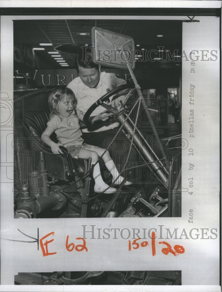 1973 tot in awe of antique fire truck, Seminole Vol. Fire Dept. - Historic Images