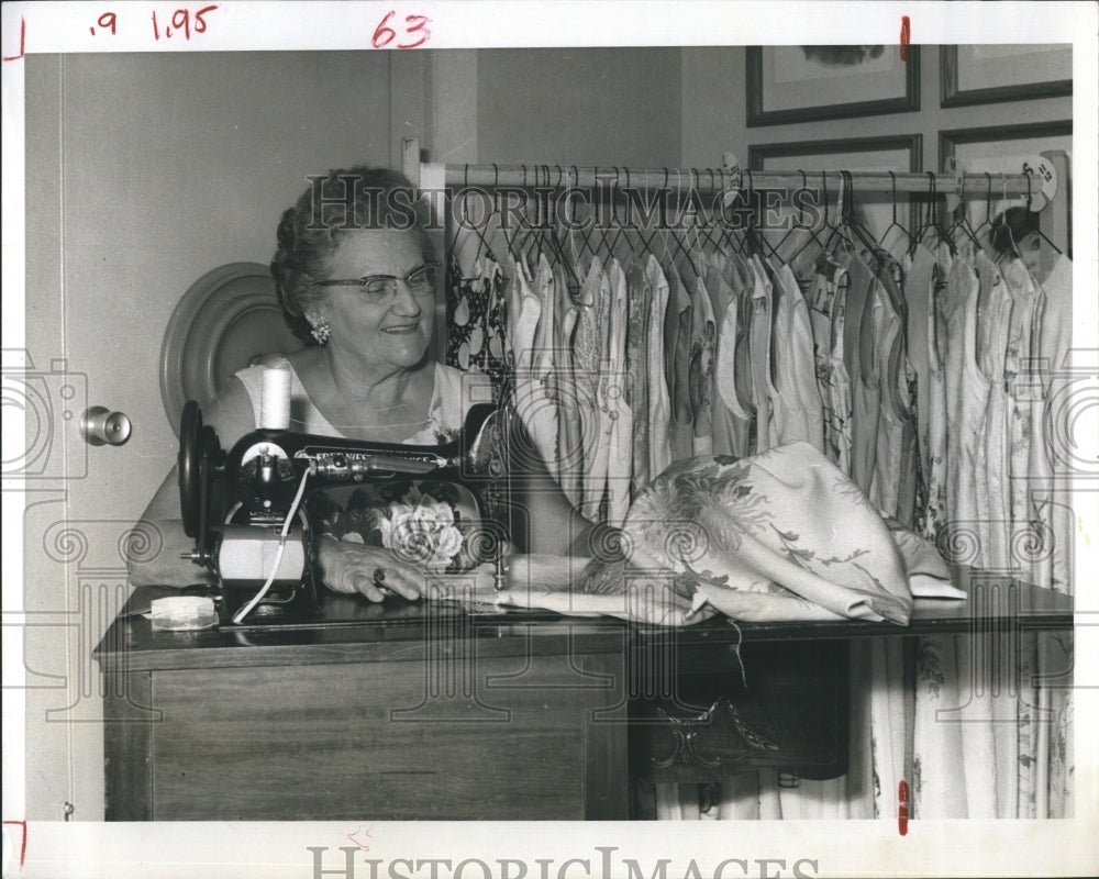 1966 Mrs. Floyde Rasor sews for charity groups - Historic Images