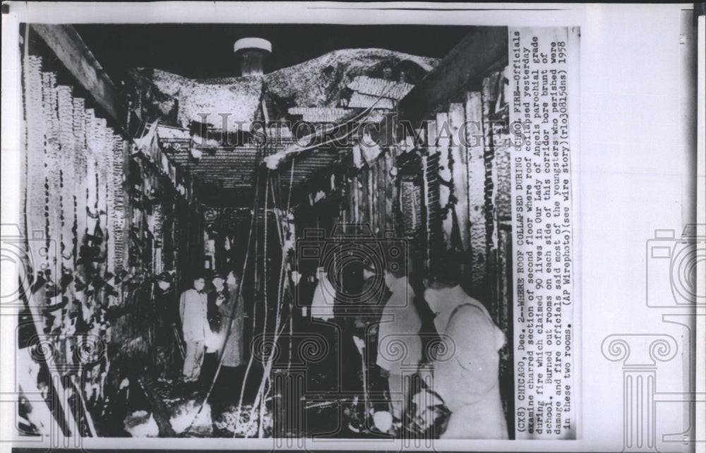 1958 Roof collapsed after the fire at Our Lady of Angles School. - Historic Images