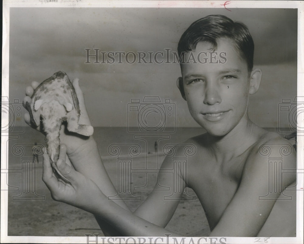 Bucky Washmund holds batfish.  - Historic Images