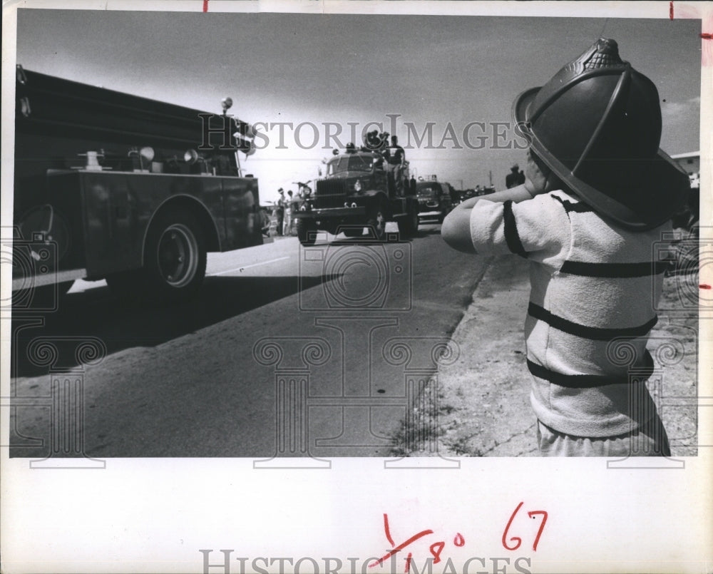 1970 Chris Schmidt, Junior Fireman Holds Ears Against Sirens - Historic Images