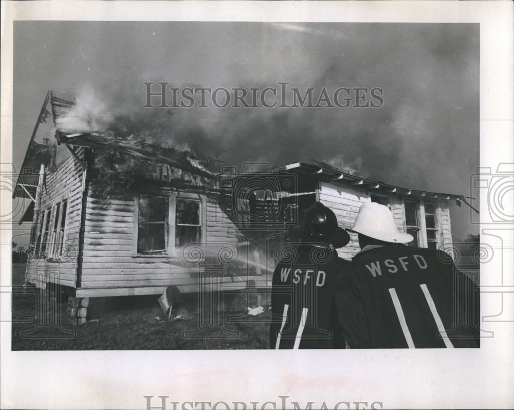 1966 Firemen burn old house near Bradenton for drill  - Historic Images
