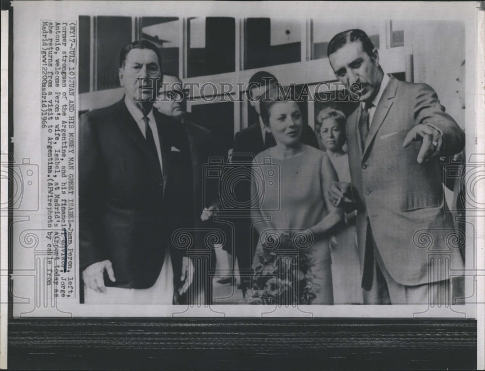 1966 Juan Peron, (L) and Jorge Antonio, greet Peron's wife Isabel - Historic Images