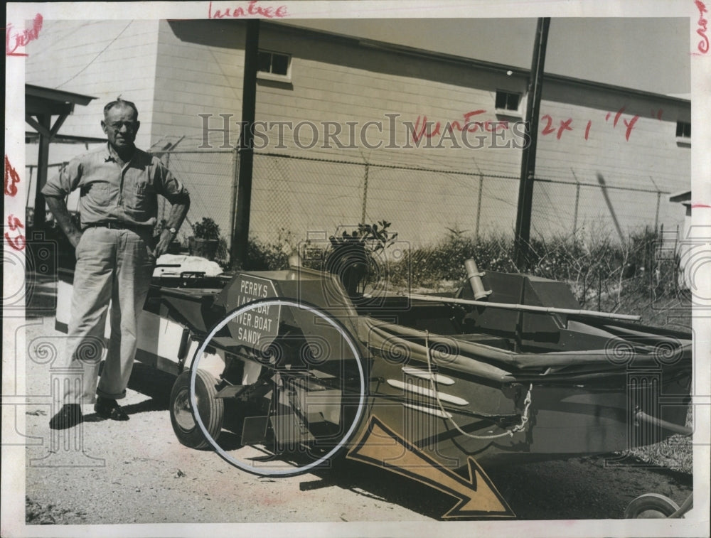 1960 N W Perry with amphibious boat,paddle wheel powered - Historic Images