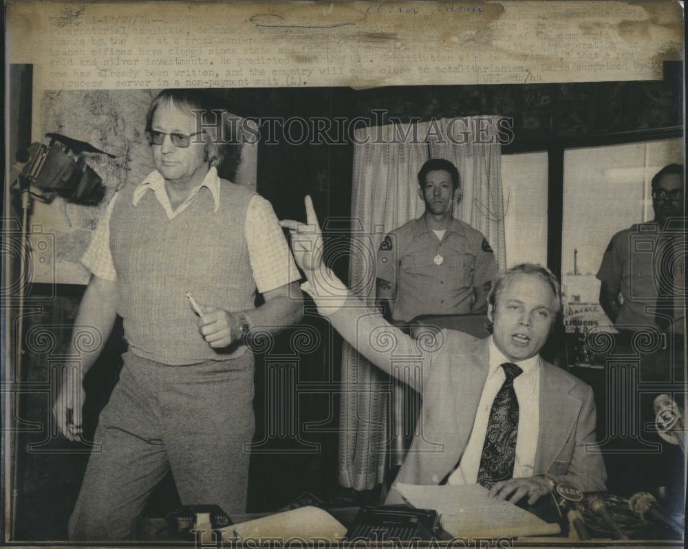 1975 Criminal Case Two Officers In Background Lawyer At Desk - Historic Images