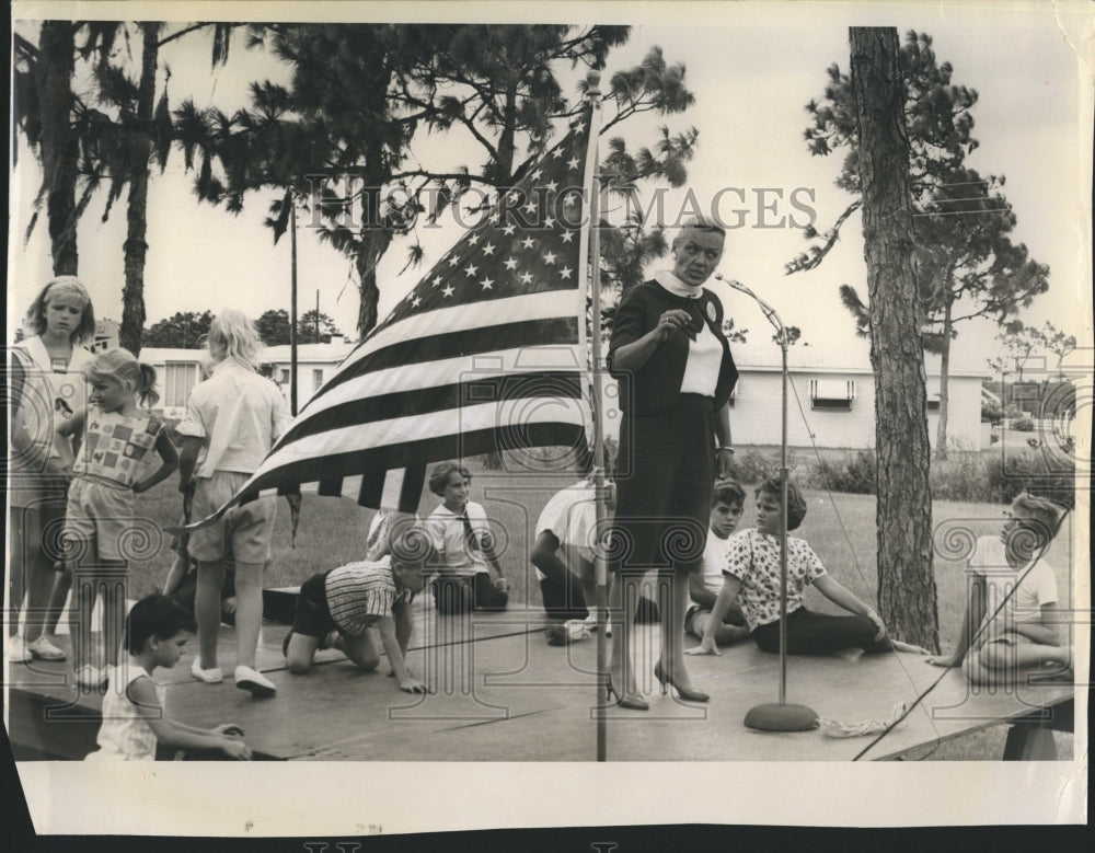 1964 Mrs. Lewis Homer, mayor's wife, speaking to the school board. - Historic Images