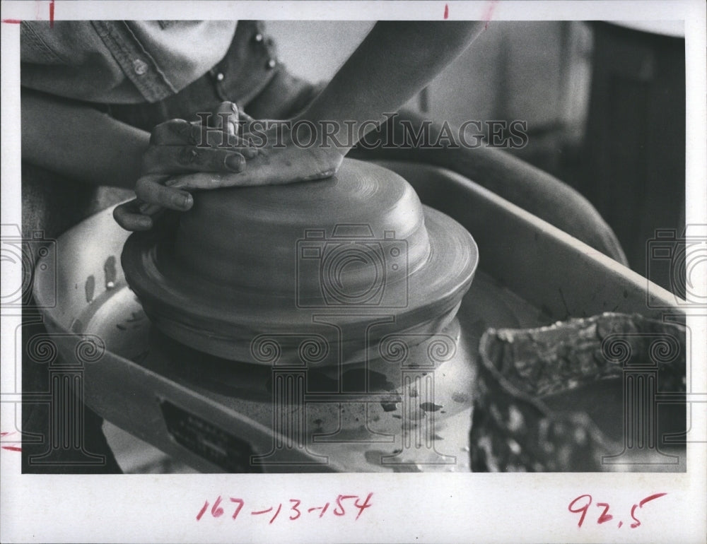 1973 Jill Hopkins on her pottery wheel. - Historic Images