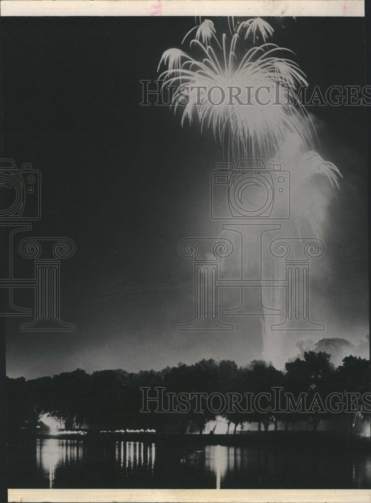 1963 Fireworks explode above a lake - Historic Images