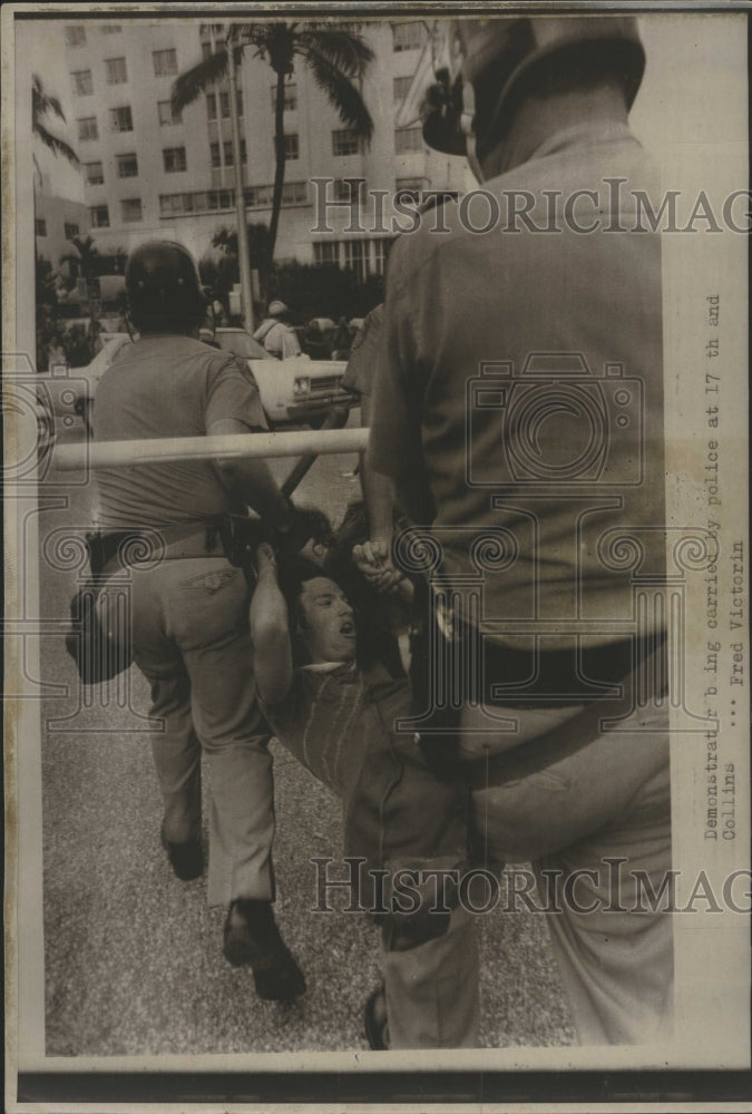 1972 Police haul demonstrators from 27th Street-Collins Ave protest - Historic Images