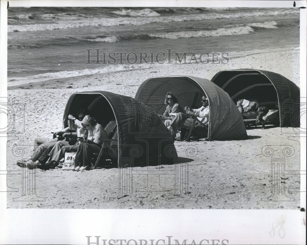 1978 People Underneath Sun Shades at Clearwater Beach Florida - Historic Images