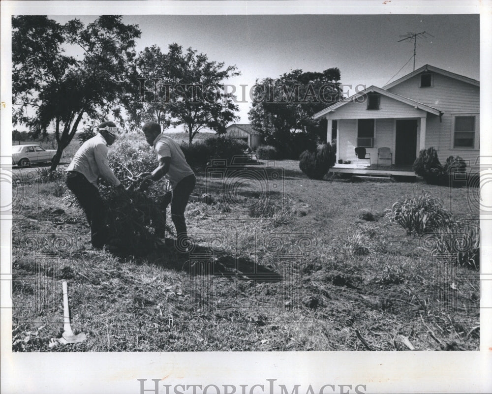 1976 Cleaning grass yard, Oklahoma. - Historic Images