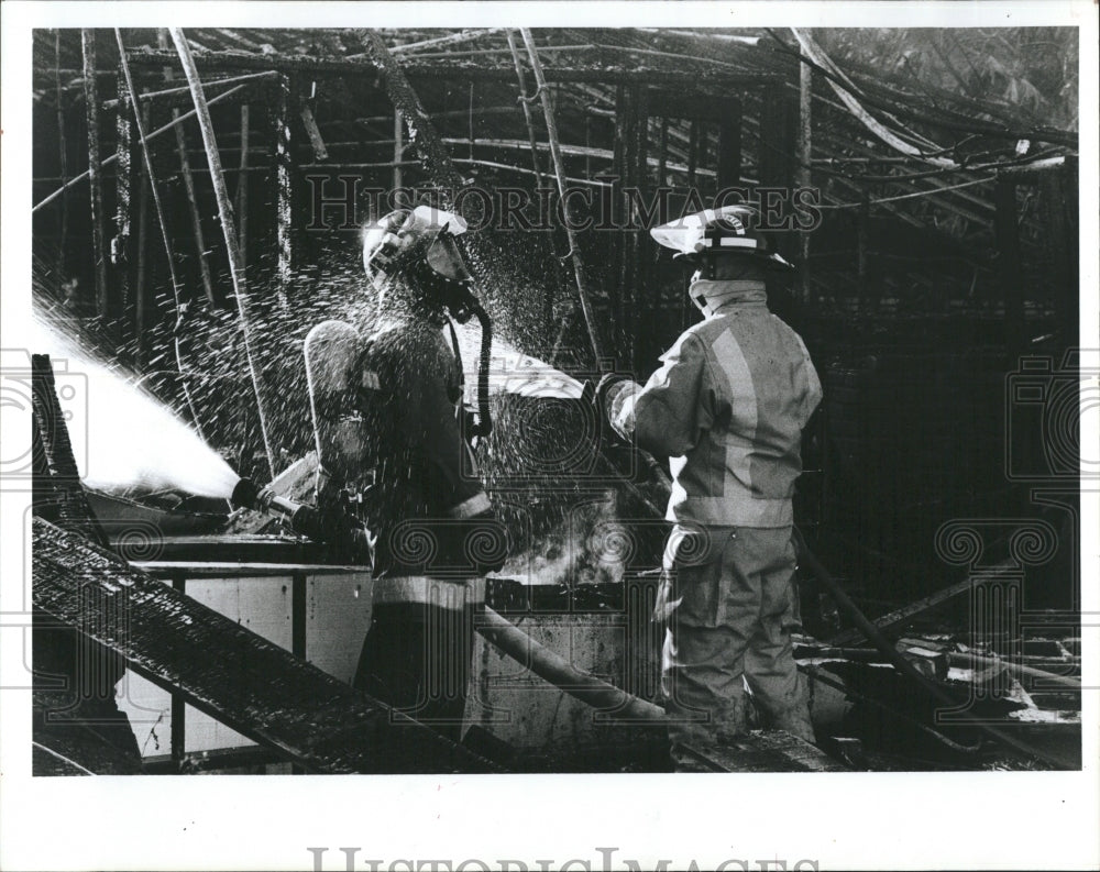 1986 Firefighter Cools off After Long Day - Historic Images