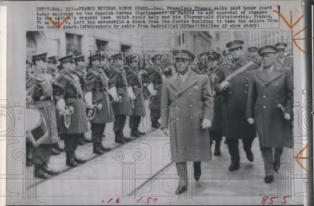 1966 Gen. Francisco Franco walks past honor guard to Spanish Cortes - Historic Images