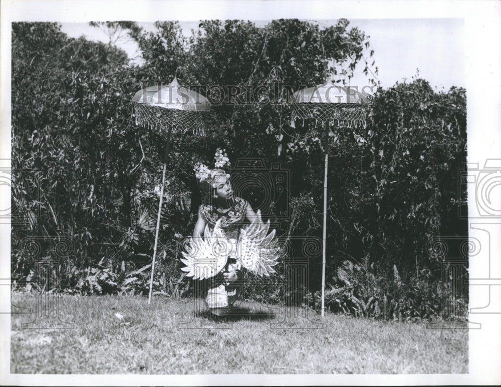 1958 Mendora dances in front of trees. - Historic Images