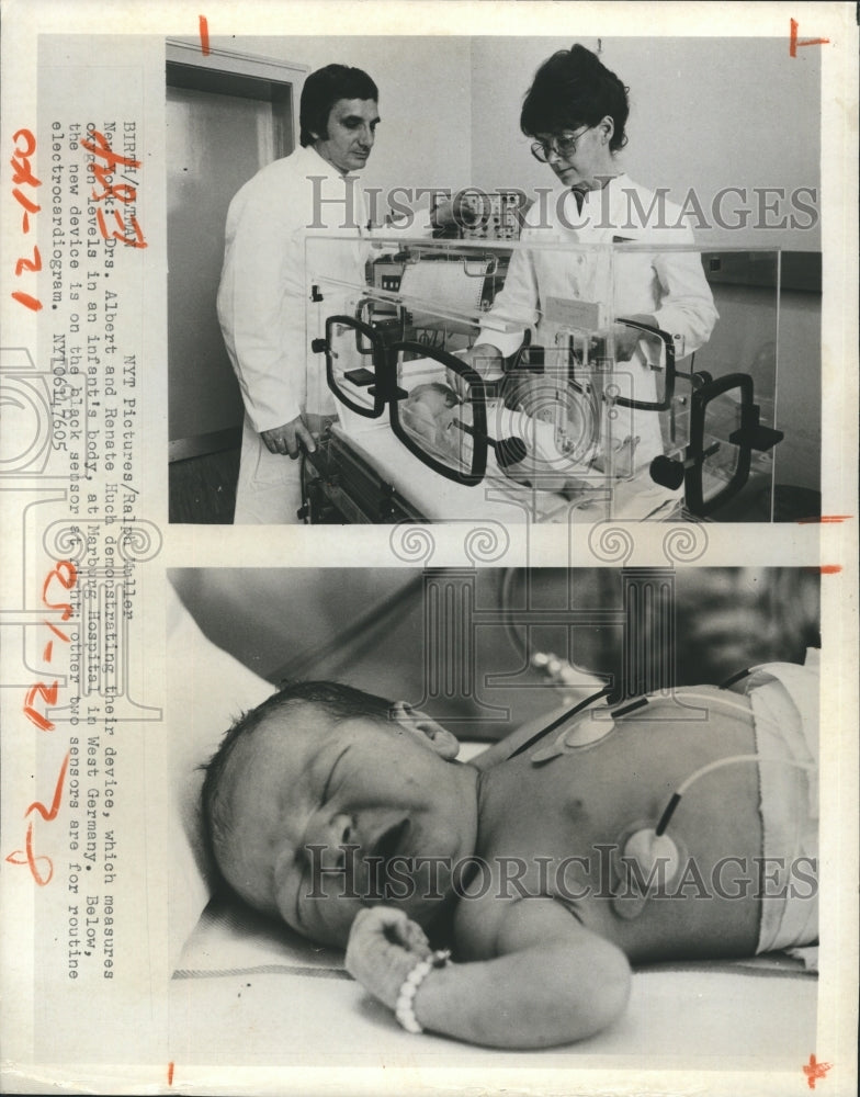 1976 Doctors demonstrate their device in an infant. - Historic Images