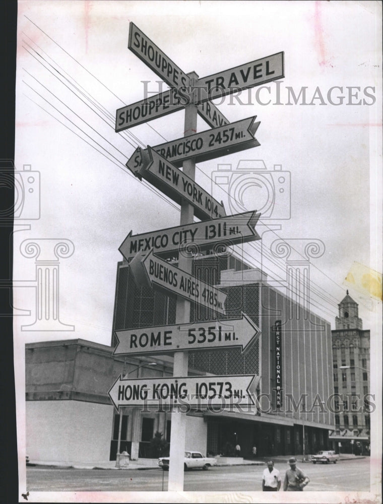 1963 Travel sign at 4th and 1st ave. - Historic Images