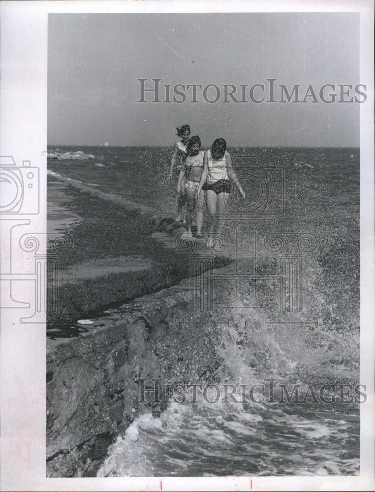 1971 Young girls walk along Floriday sea wall - Historic Images