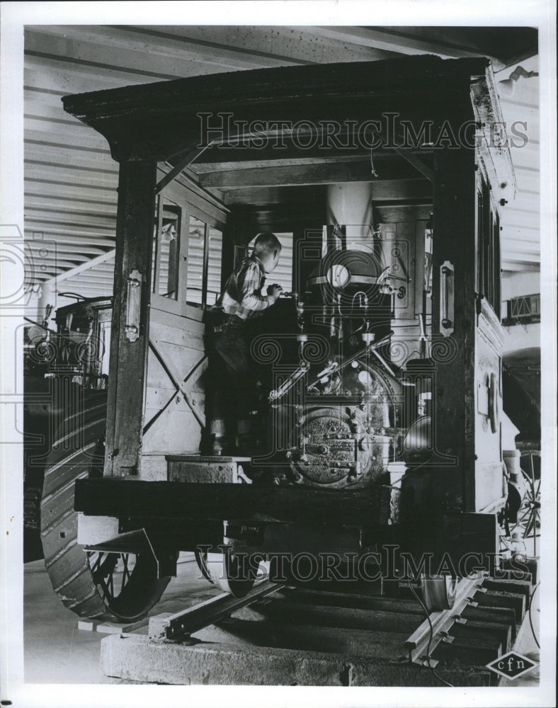 1965 Boy standing in a train - Historic Images