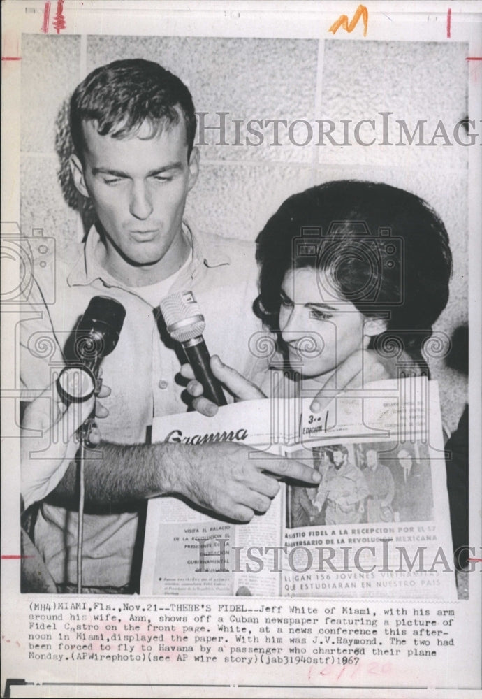 1967 Jeff White and his wife and a newspaper from Cuba - Historic Images