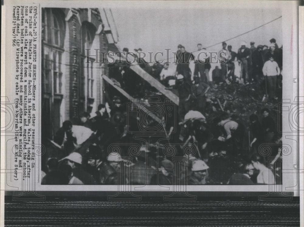 1966 Miners and rescuers try to dig children out of school - Historic Images