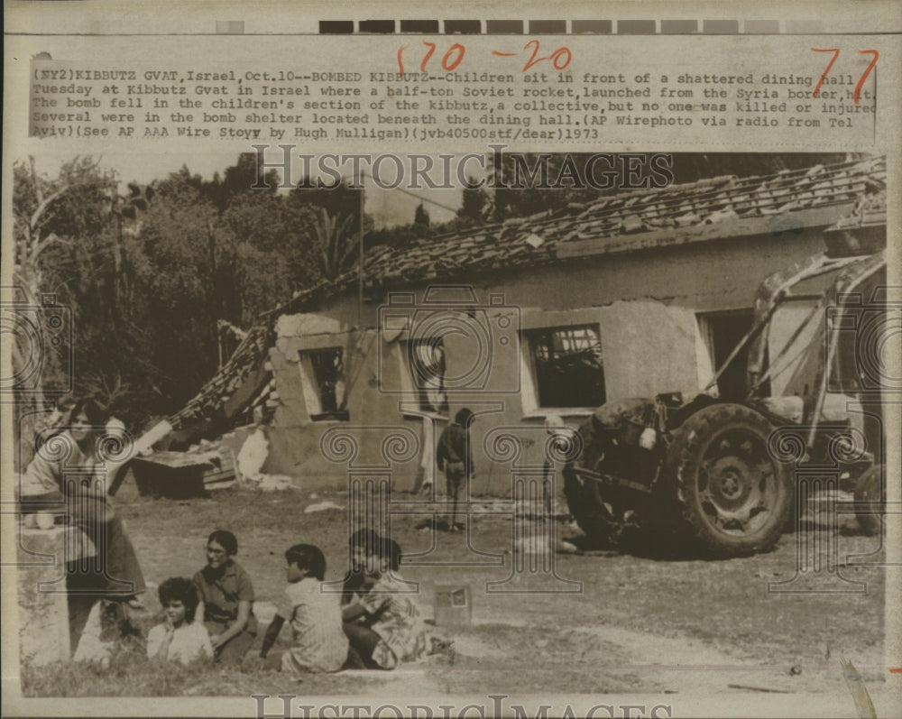 1973 Children sit in front of shattered dining hall - Historic Images