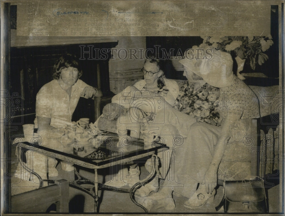 Older people sitting at table-Historic Images