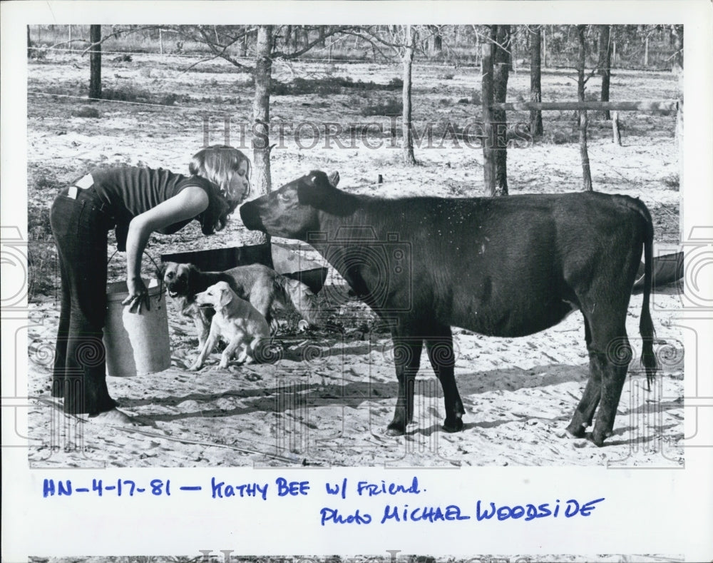 1981 Press Photo Kathy Bee With friend cow gets a kiss - RSJ02847 - Historic Images