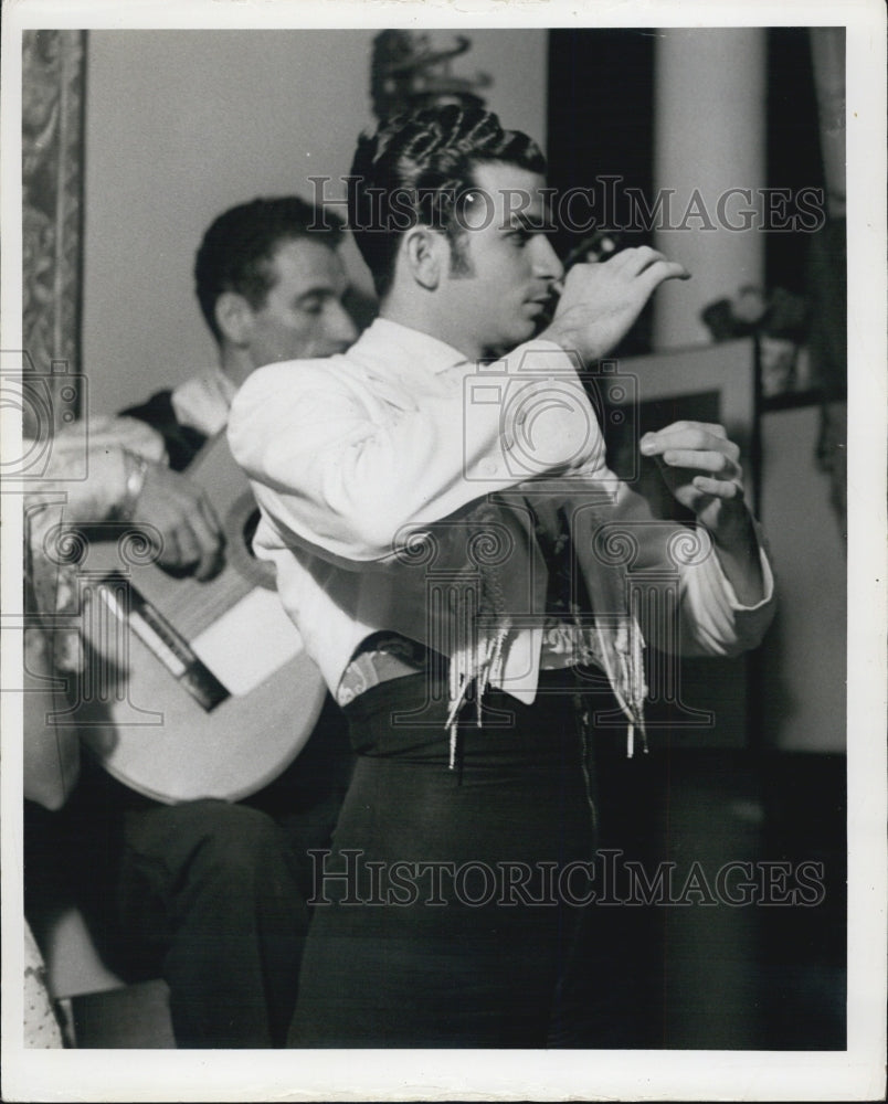 Press Photo Man In Dress Shirt Dances While Other Plays Guitar - Historic Images