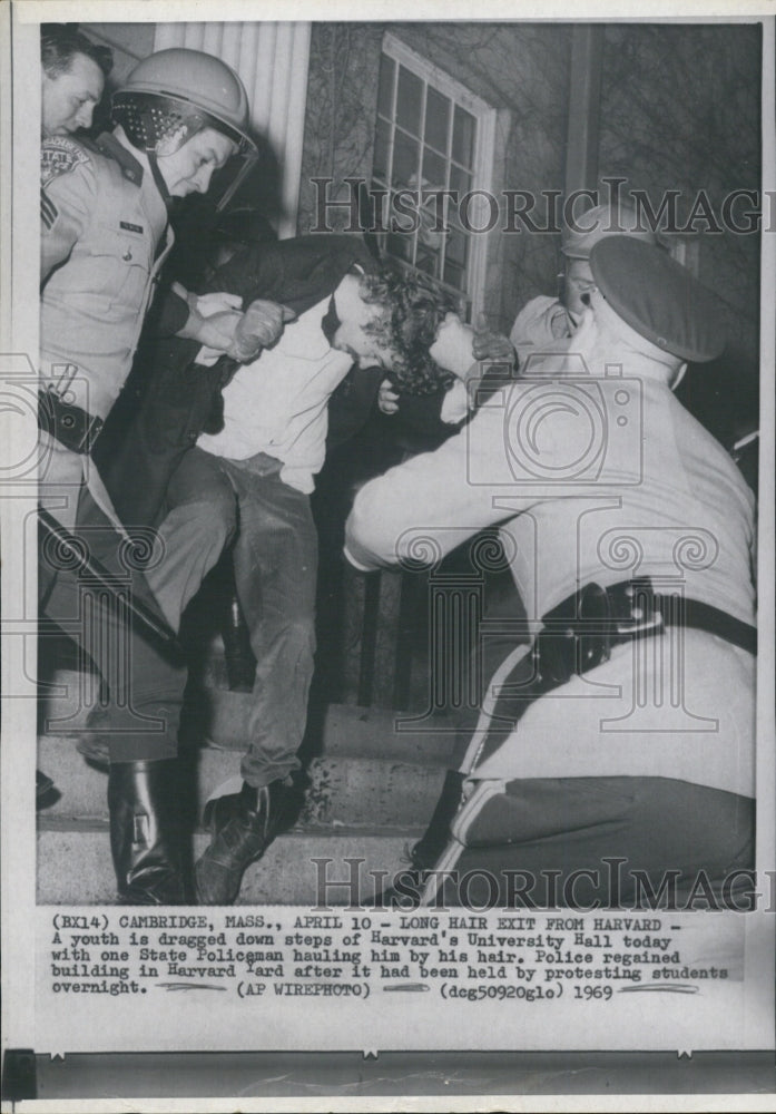 1969 Youth dragged out of Harvard University policeman-Historic Images