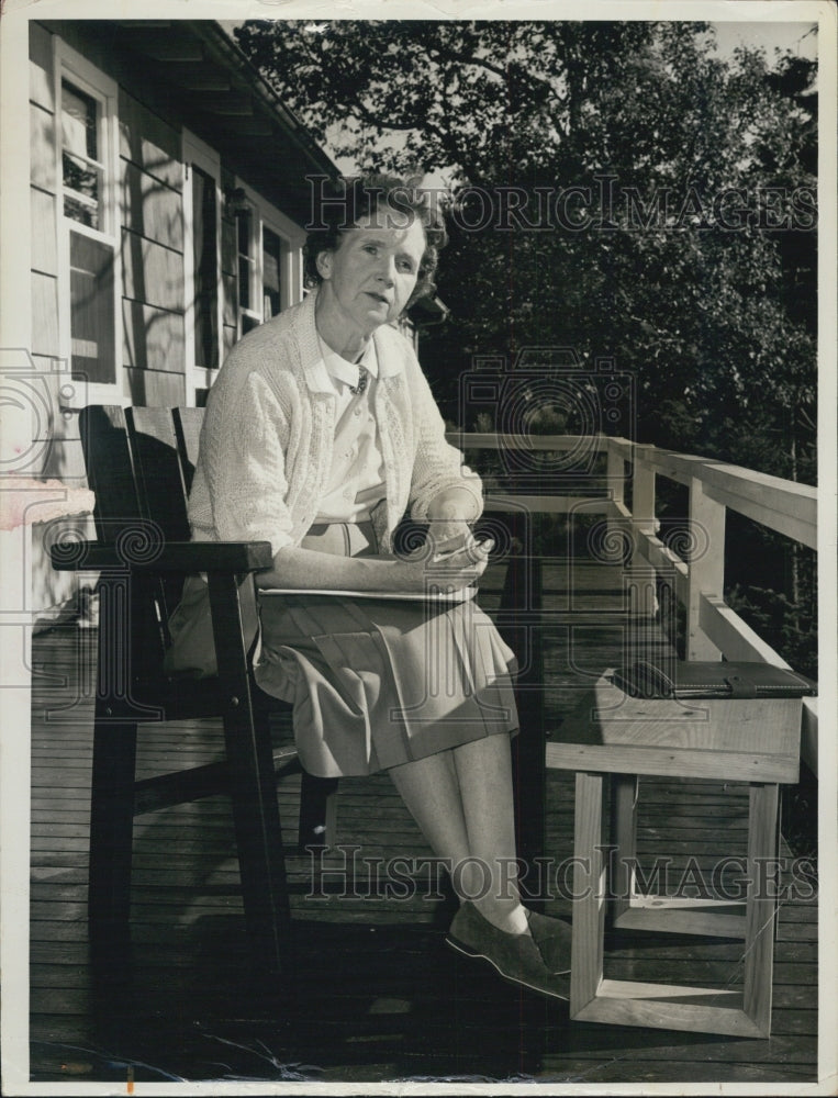 1963 Press Photo Unknown woman sitting on porch outdoors of home - RSJ11021 - Historic Images