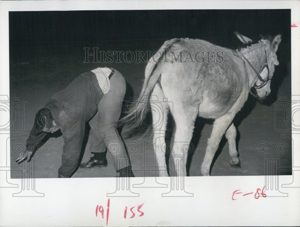 1969 Press Photo John Short Makes Sad Attempt to Ride Donkey - RSJ14565 - Historic Images