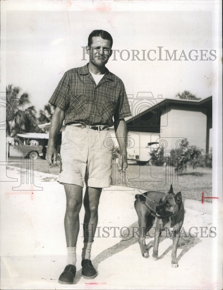 1958 Press Photo Gilbert Unruh Walking Dog For Pet Sitting Business - RSJ16437 - Historic Images