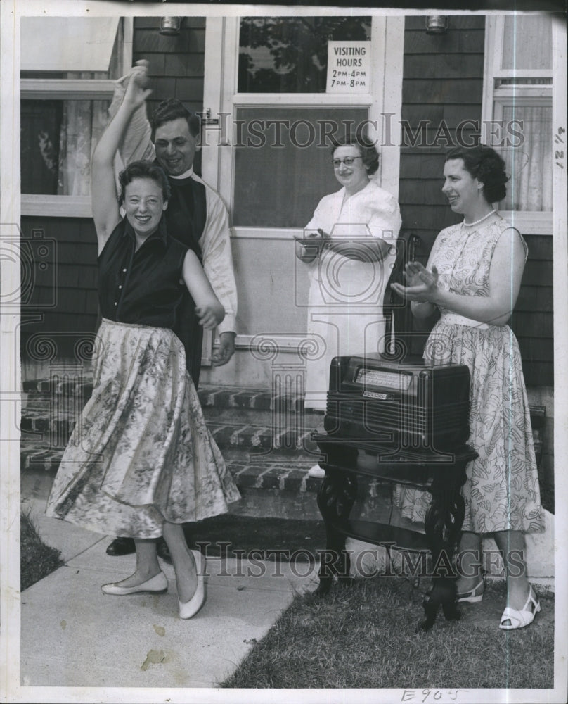 1957 Press Photo Rev. John E.Hornboy dances his wife and friends. - Historic Images