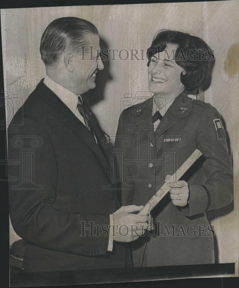 1965 Army Nurse Theresa O&#39;Dwyer and Gov. John Volpe. - Historic Images