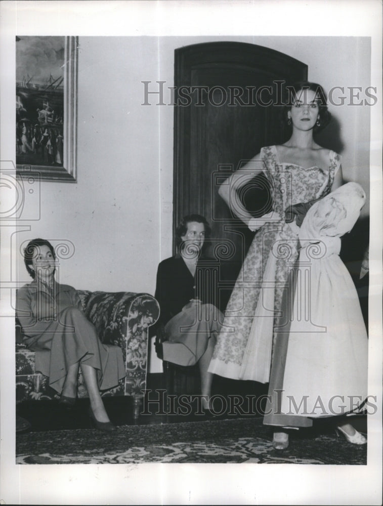 1955 Princess Maria Pia admiring a cocktail dress being modeled - Historic Images