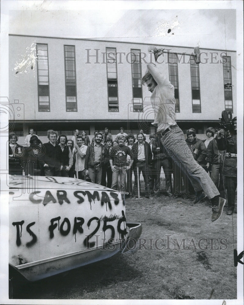 1974 Press Photo Steve Likos takes a leaping smash at an automobile - Historic Images