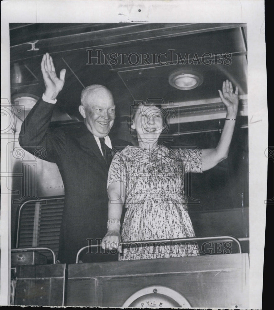 1961 Press Photo Former Pres. and Mrs. Eisenhower wave from back of a train. - Historic Images