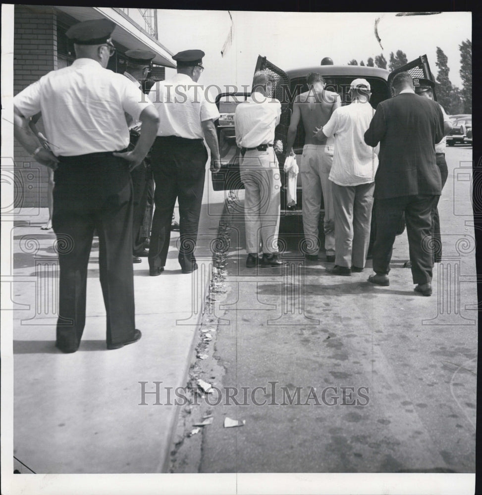 1960 Press Photo Man arrested at 75th st beach in Chicago - Historic Images