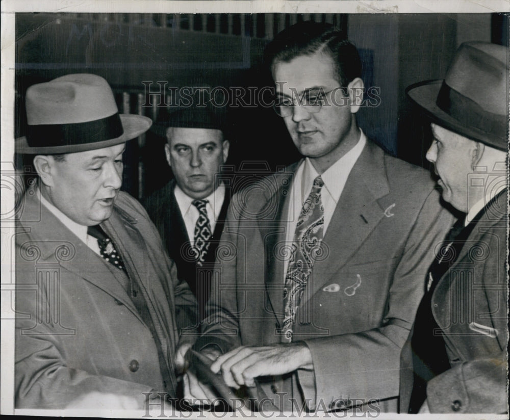 1948 Press Photo Dr. Robert C. Rutledge booked on Murder Charges - Historic Images