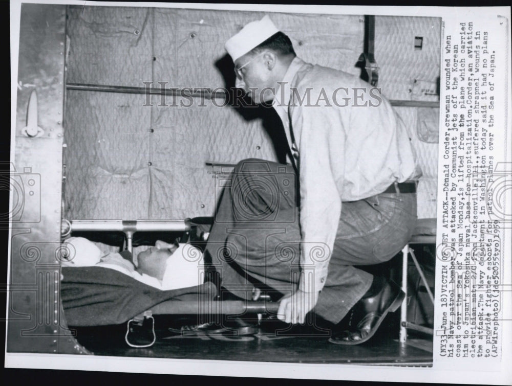 1959 Press Photo U.S. airman Donald Corder wounded during jet attack off Korea - Historic Images