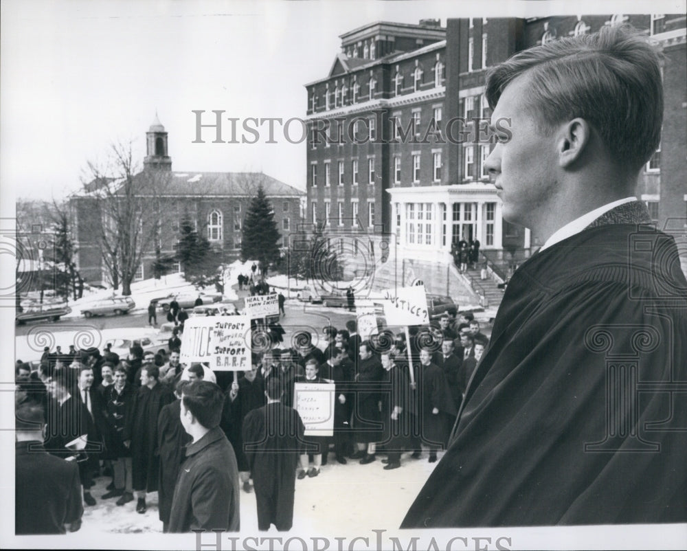 1965 Press Photo John T.Hoban,student of Holy cross watches a Demonstration. - Historic Images