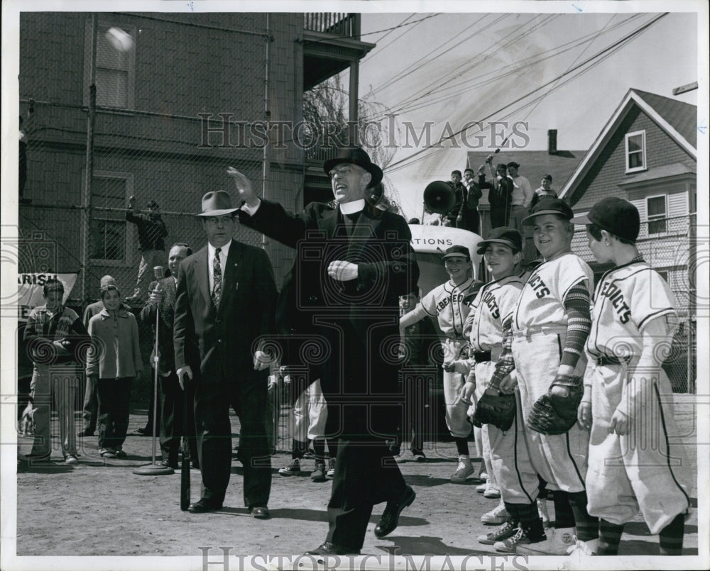 1958 Press Photo Rev John G.Hogan throws out the first ball. - Historic Images