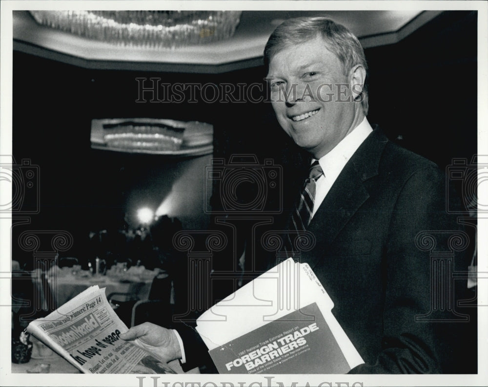 1988 Press Photo Richard Gerhardt Holding Boston Herald - Historic Images