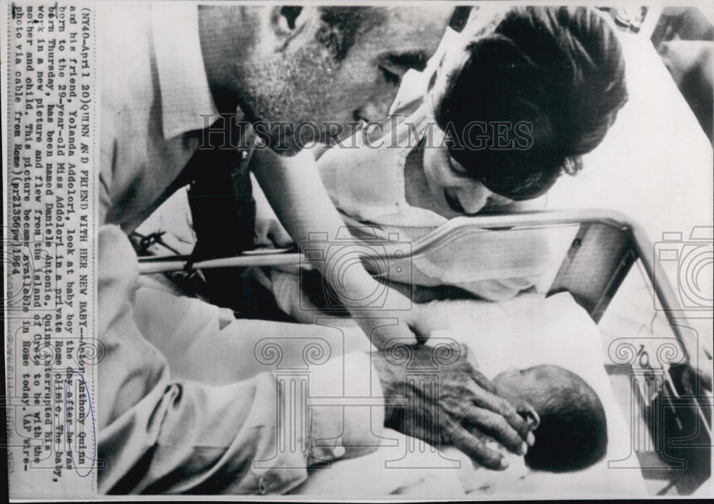 1964 Actor Anthony Quinn with friend Yolanda Addolori with her baby. - Historic Images