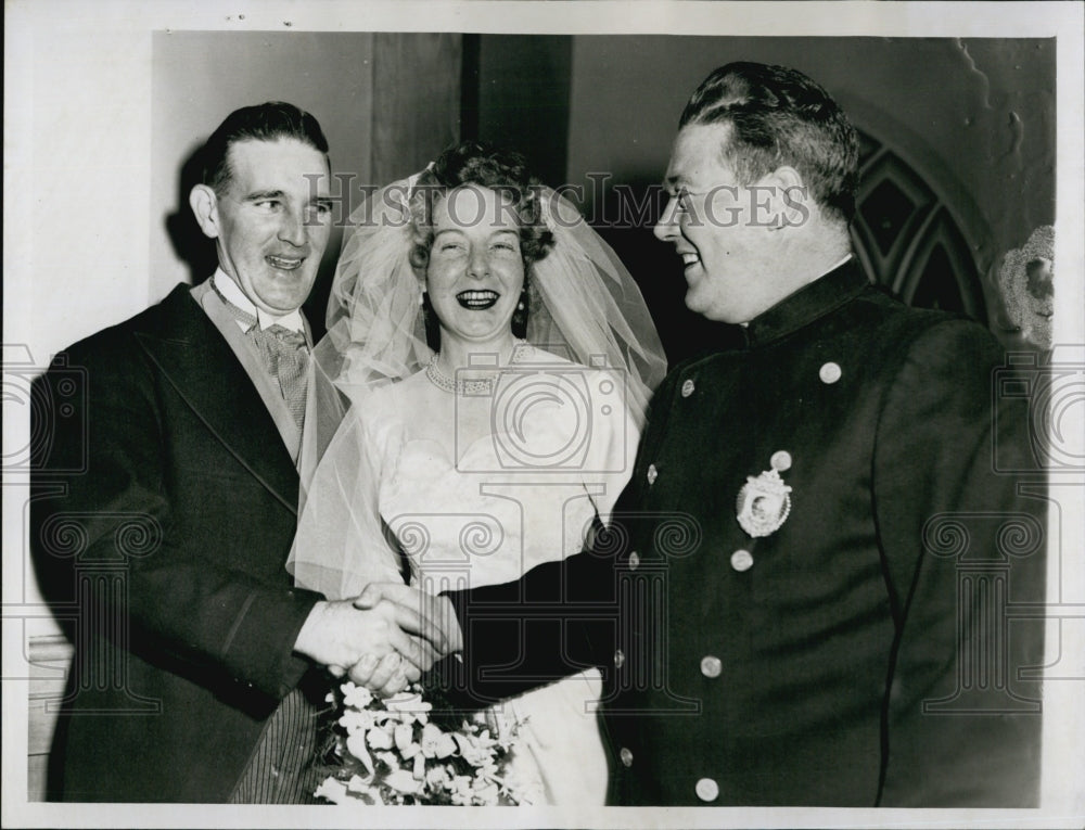 1952 Officer and Mrs.Joseph Connolly congratulated by fellow officer-Historic Images