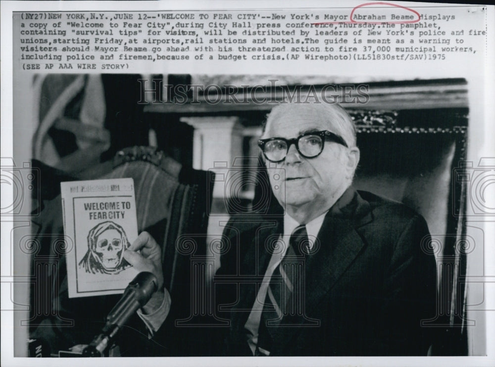 1975 Mayor Abraham Beame of N.Y.  displays a leaflet "Survval Tip"-Historic Images