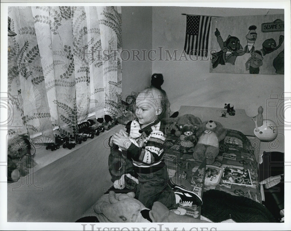 Press Photo John Duckworth III With Toys - Historic Images