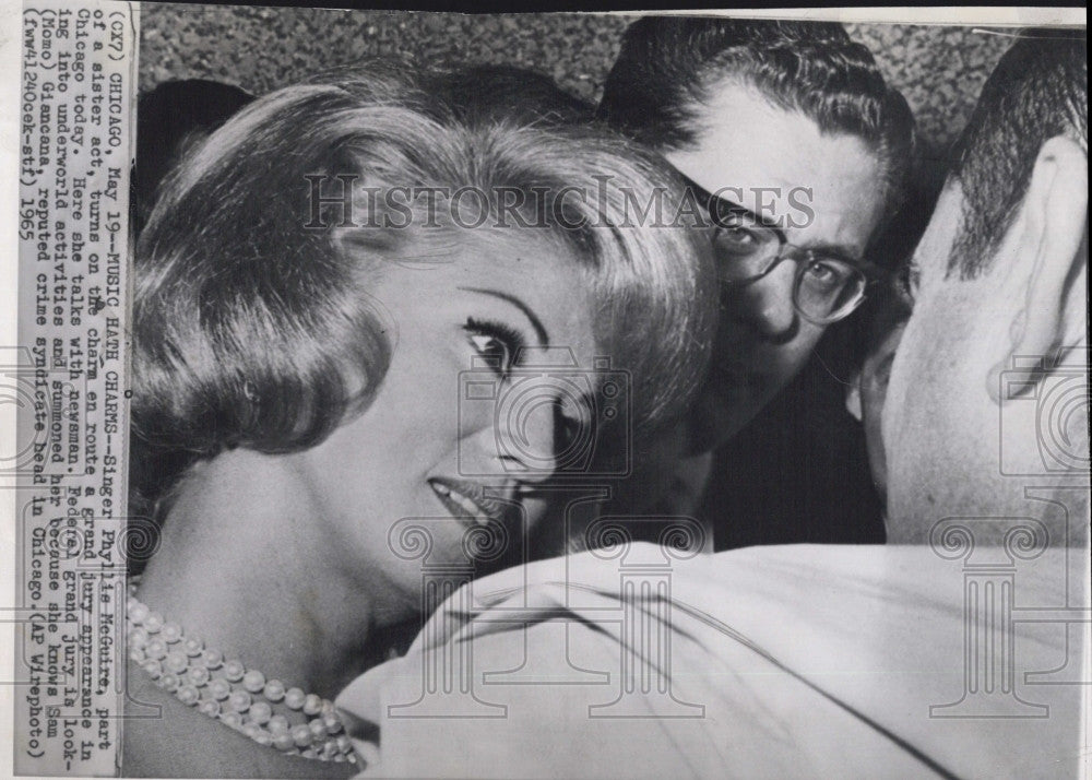 1965 Press Photo Singer Phyllis McGuire talks to newsman. - Historic Images